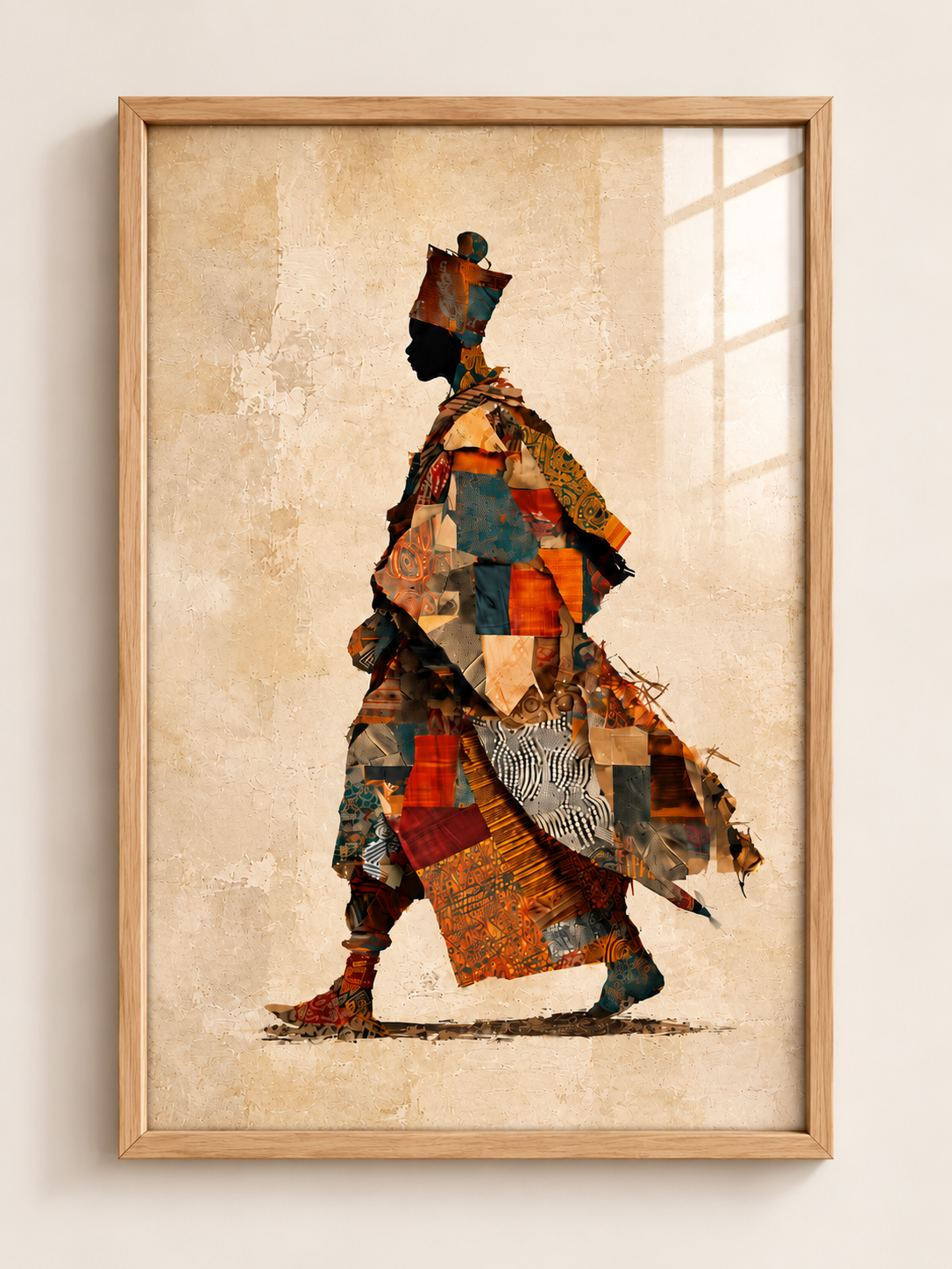 African woman A3 framed wall art in a tall light oak frame with warm beige, orange and teal patchwork portrait by ALENO